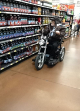 Old Man On a Chopper In Walmart Buying Soda