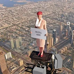 Woman Stands On Top Of Burj Khalifa