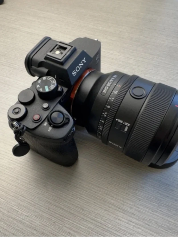 sony a7 iv camera, half cage, and top handle (lens not included).there's a littl thumbnail 2