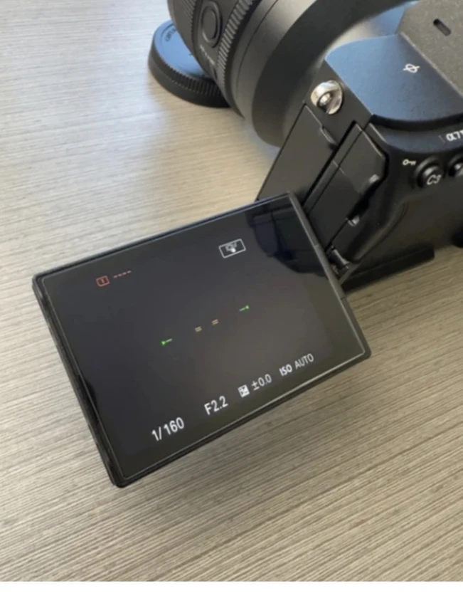 sony a7 iv camera, half cage, and top handle (lens not included).there's a littl thumbnail 3
