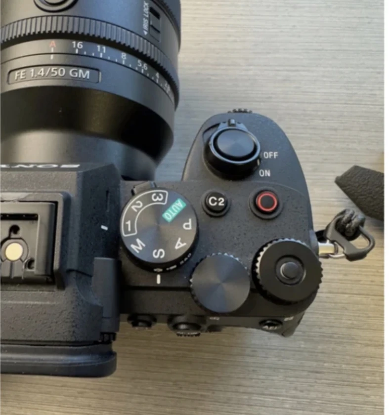 sony a7 iv camera, half cage, and top handle (lens not included).there's a littl thumbnail 4