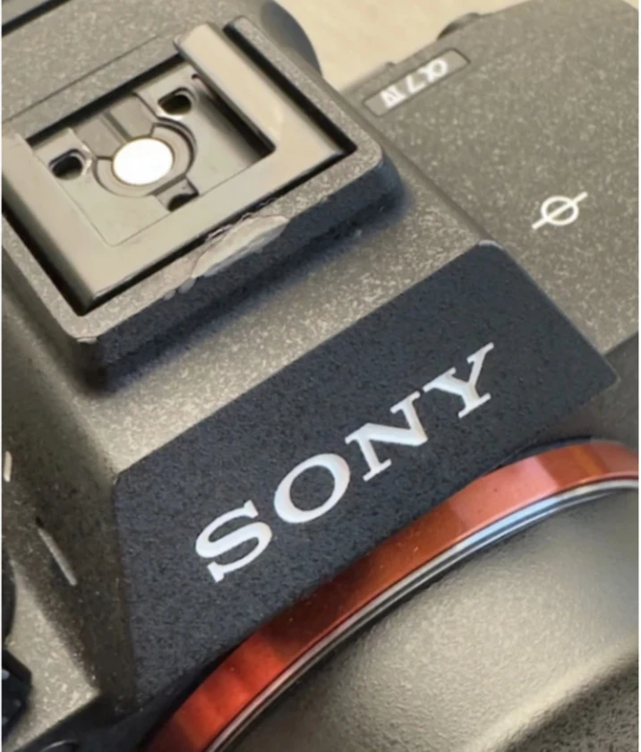 sony a7 iv camera, half cage, and top handle (lens not included).there's a littl thumbnail 5
