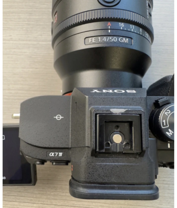 sony a7 iv camera, half cage, and top handle (lens not included).there's a littl thumbnail 7